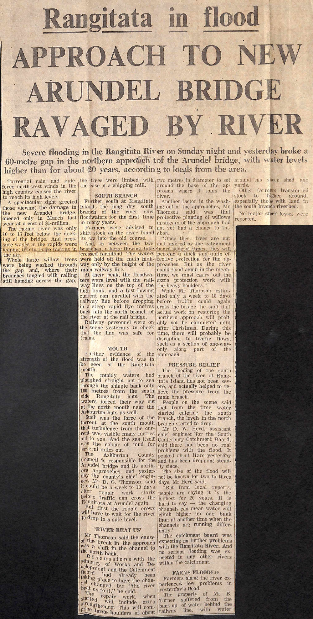 Rangitata in flood: Approach to new Arundel Bridge ravaged by river