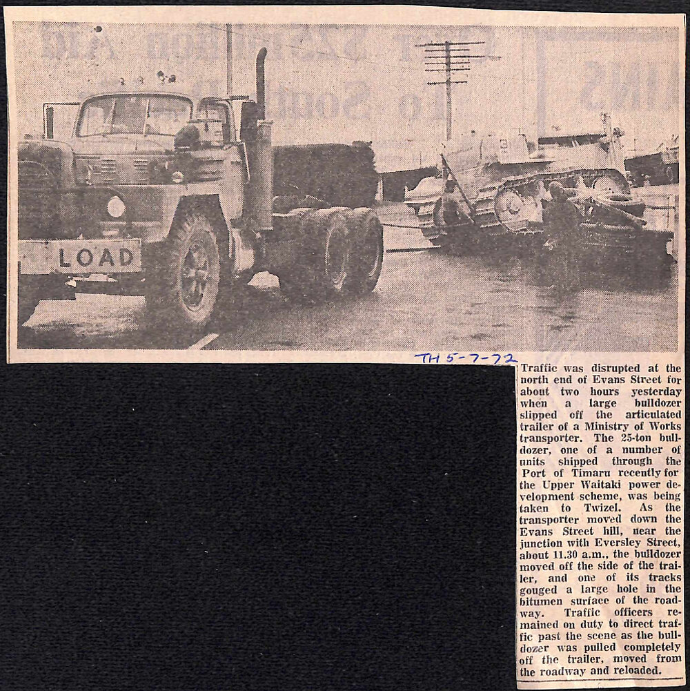 Bulldozer slips off MOW trailer