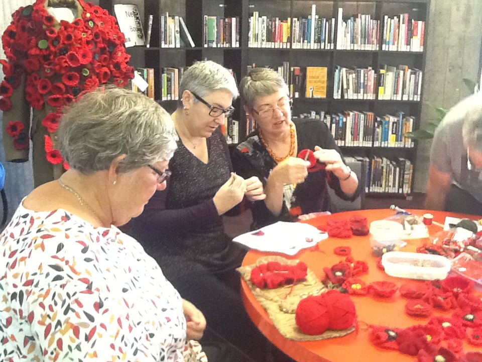 Aoraki Embroiderers' Guild making poppies