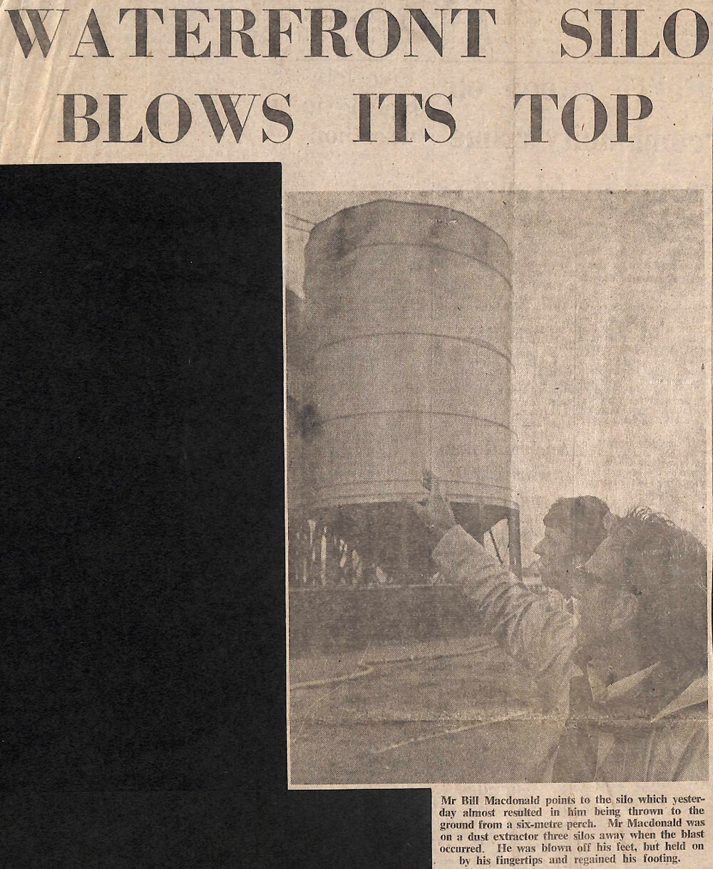 Waterfront silo blows its top, Roof cone ends in sea