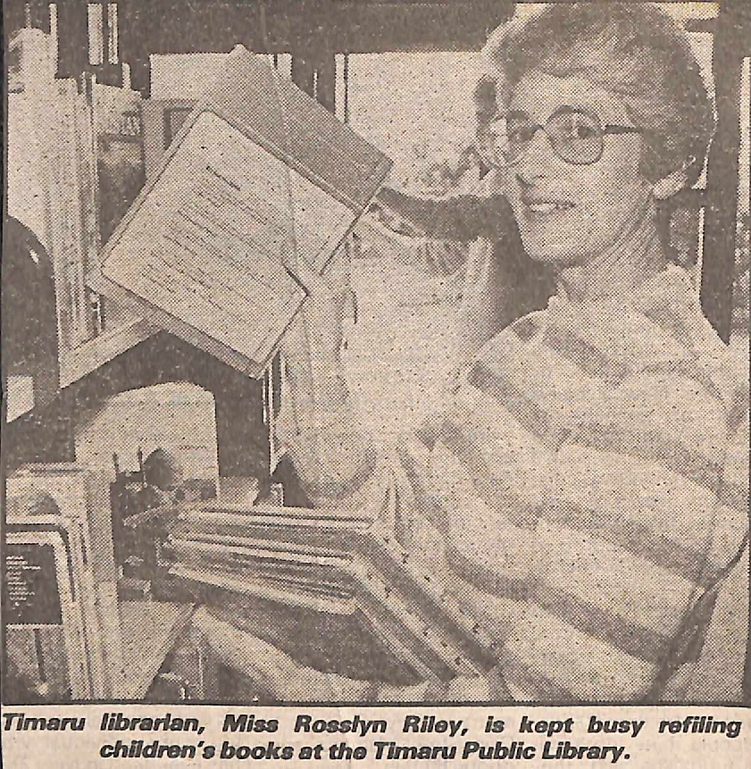 Timaru librarian, Miss Rosslyn Riley, is kept busy refiling children's books at the Timaru Public Library