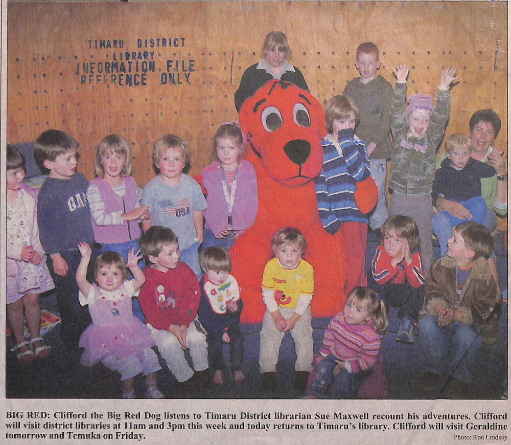 Big Red: Clifford the Big Red Dog listens to Timaru District librarian Sue Maxwell
