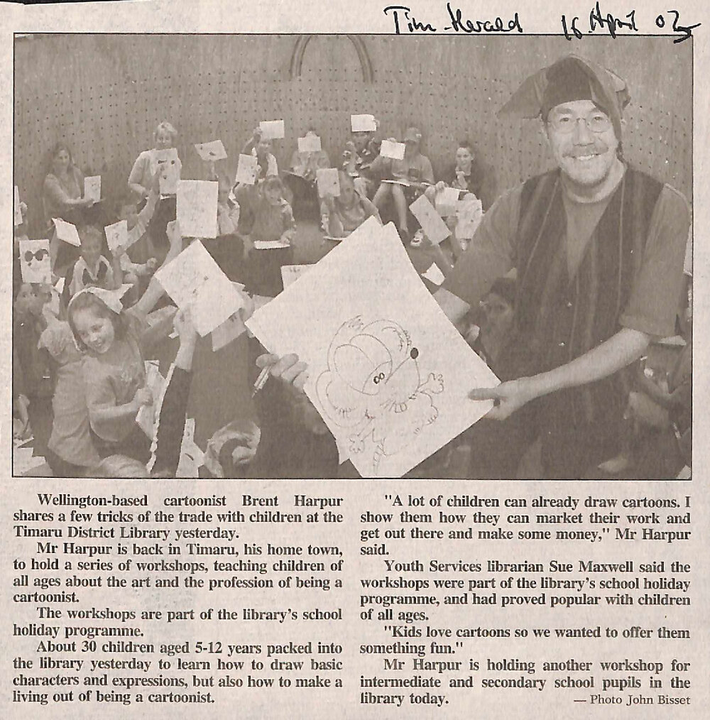Wellington based cartoonist Brent Harpur shares a few tricks of the trade with children at the Timaru District Library