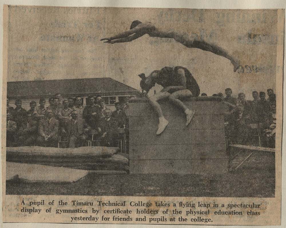A pupil of the Timaru Technical College takes a flying leap in a spectacular display of gymnastics