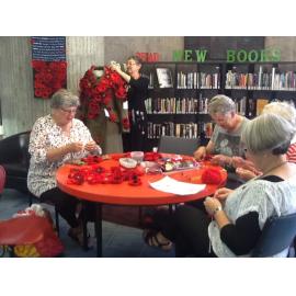 Aoraki Embroiderers' Guild making poppies