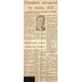 President attracted by music, drill / MacGregor tartan distinctive feature