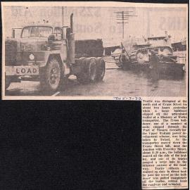 Bulldozer slips off MOW trailer