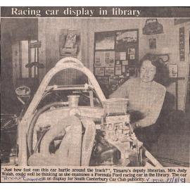 Racing car display in library