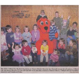 Big Red: Clifford the Big Red Dog listens to Timaru District librarian Sue Maxwell