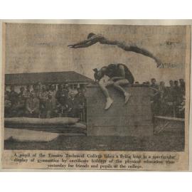 A pupil of the Timaru Technical College takes a flying leap in a spectacular display of gymnastics