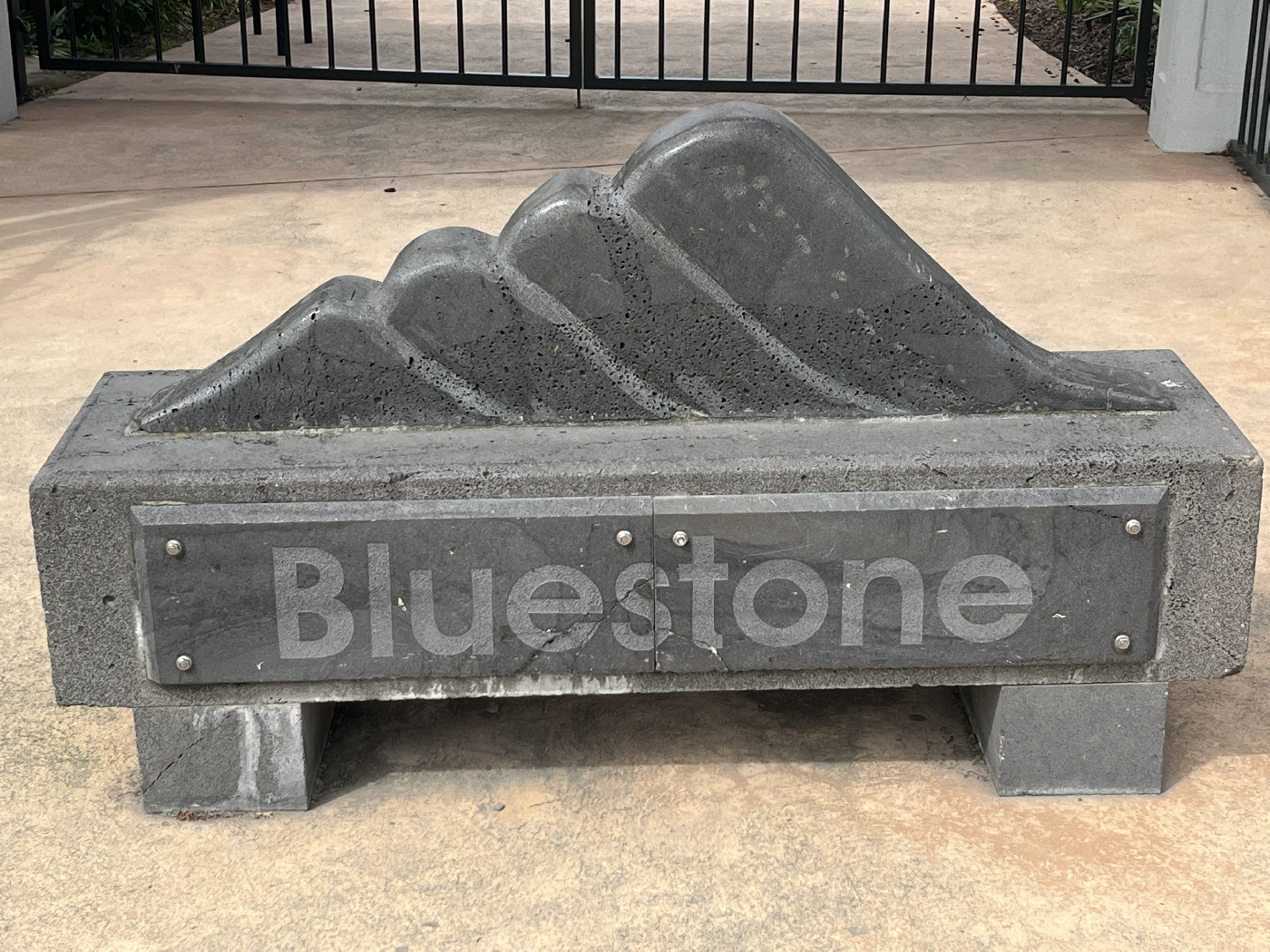 TDL image 2022, showing Bluestone School logo at Raymond Street entrance, by sculptor Peter Hooper.